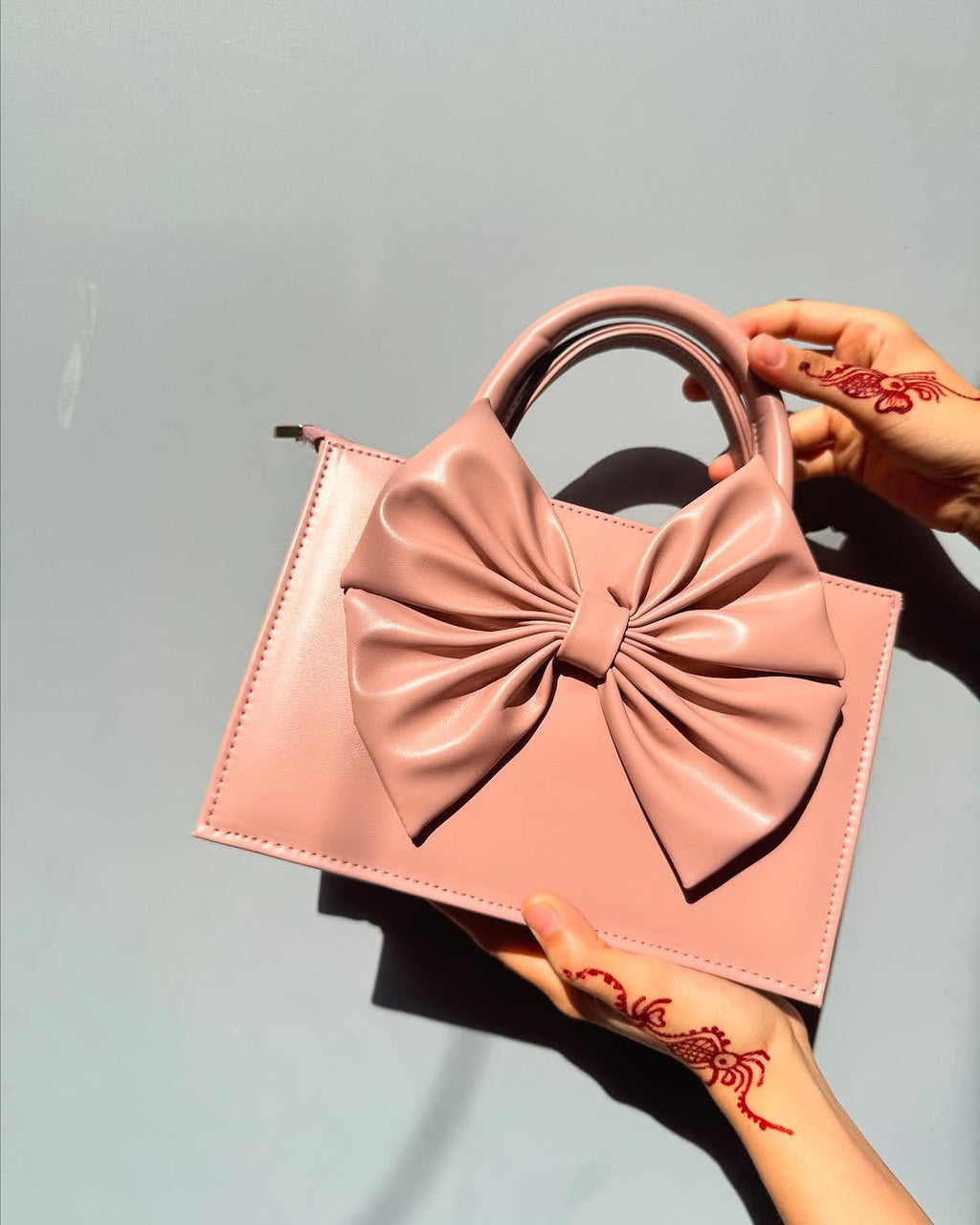 Buy HandBag Gloss Bow Soft Pink in Pakistan