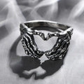Buy Orb & Gravel Skeleton Hands Heart Ring Size 7 Us in Pakistan