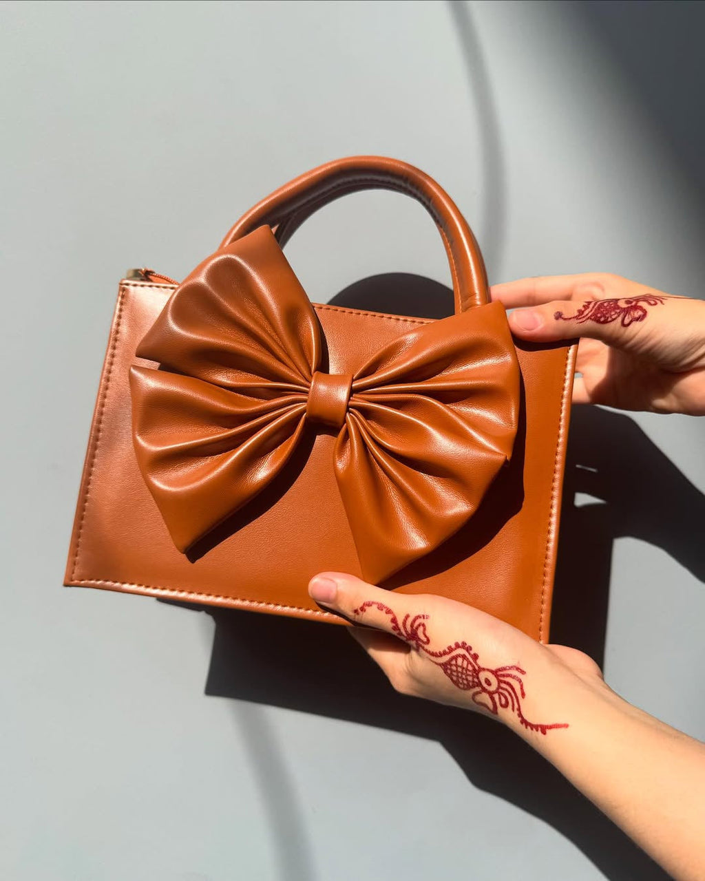 Buy HandBag Gloss Bow Brown in Pakistan